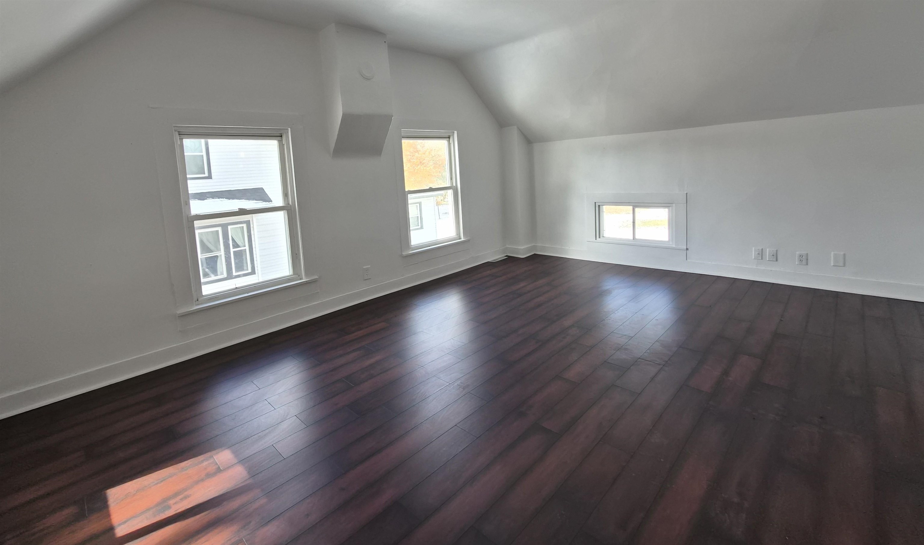 301 West Main Street Durand, IL 61024 - Photo 18 of 32 an empty room with wooden floor and windows