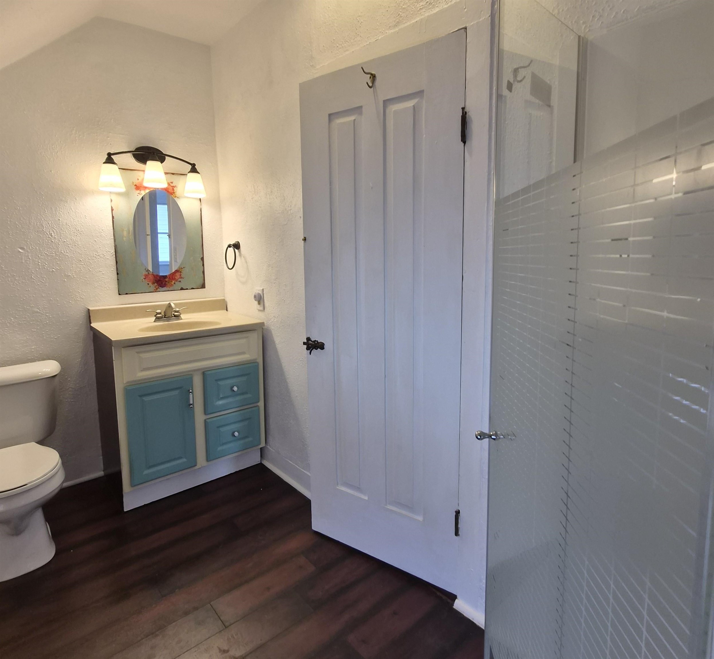301 West Main Street Durand, IL 61024 - Photo 19 of 32 a bathroom with a granite countertop sink toilet and shower
