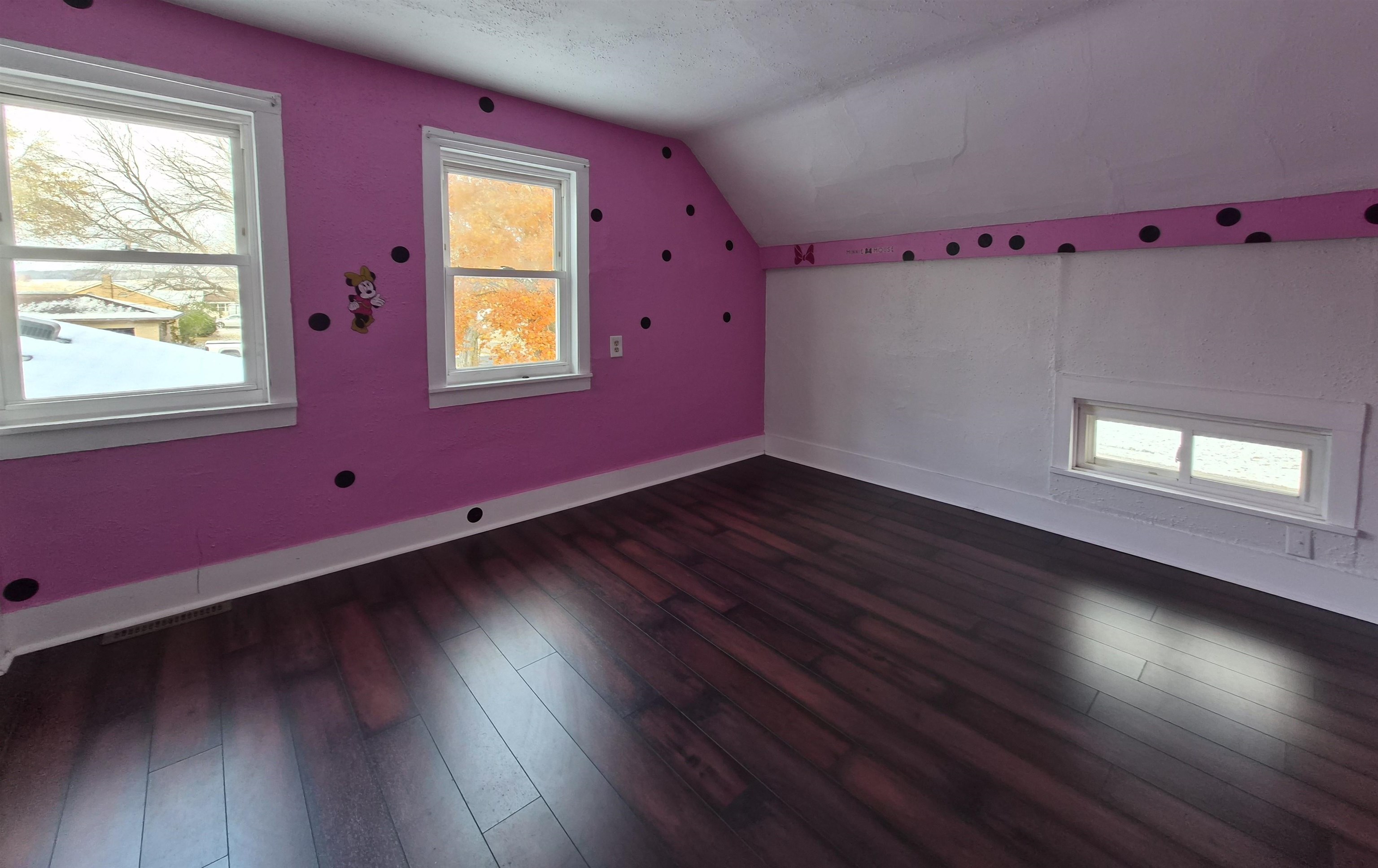 301 West Main Street Durand, IL 61024 - Photo 24 of 32 a view of an empty room with wooden floor and a window