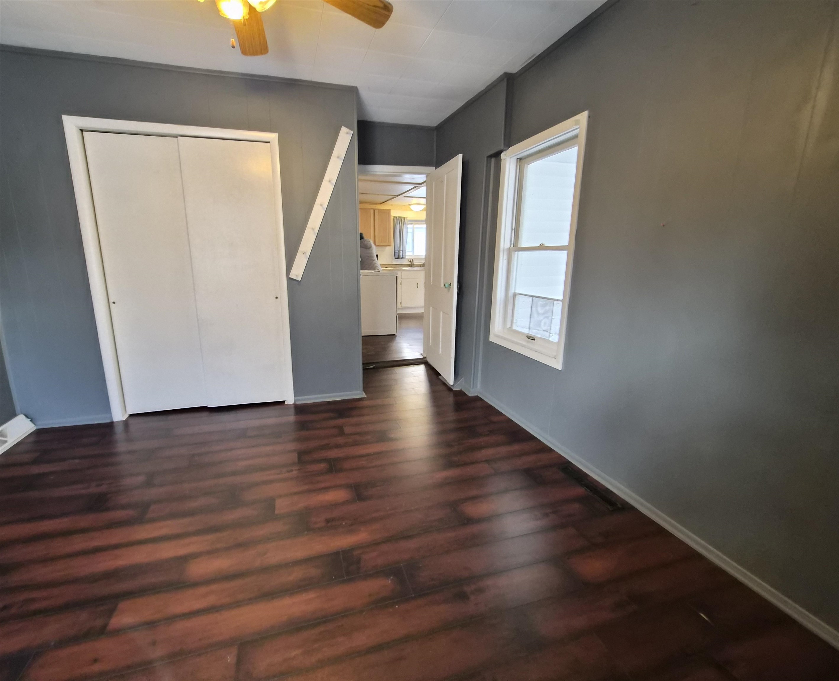301 West Main Street Durand, IL 61024 - Photo 25 of 32 a view of an empty room with wooden floor and a window