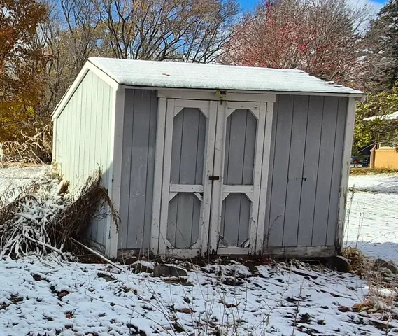 a wooden door with a wooden fence