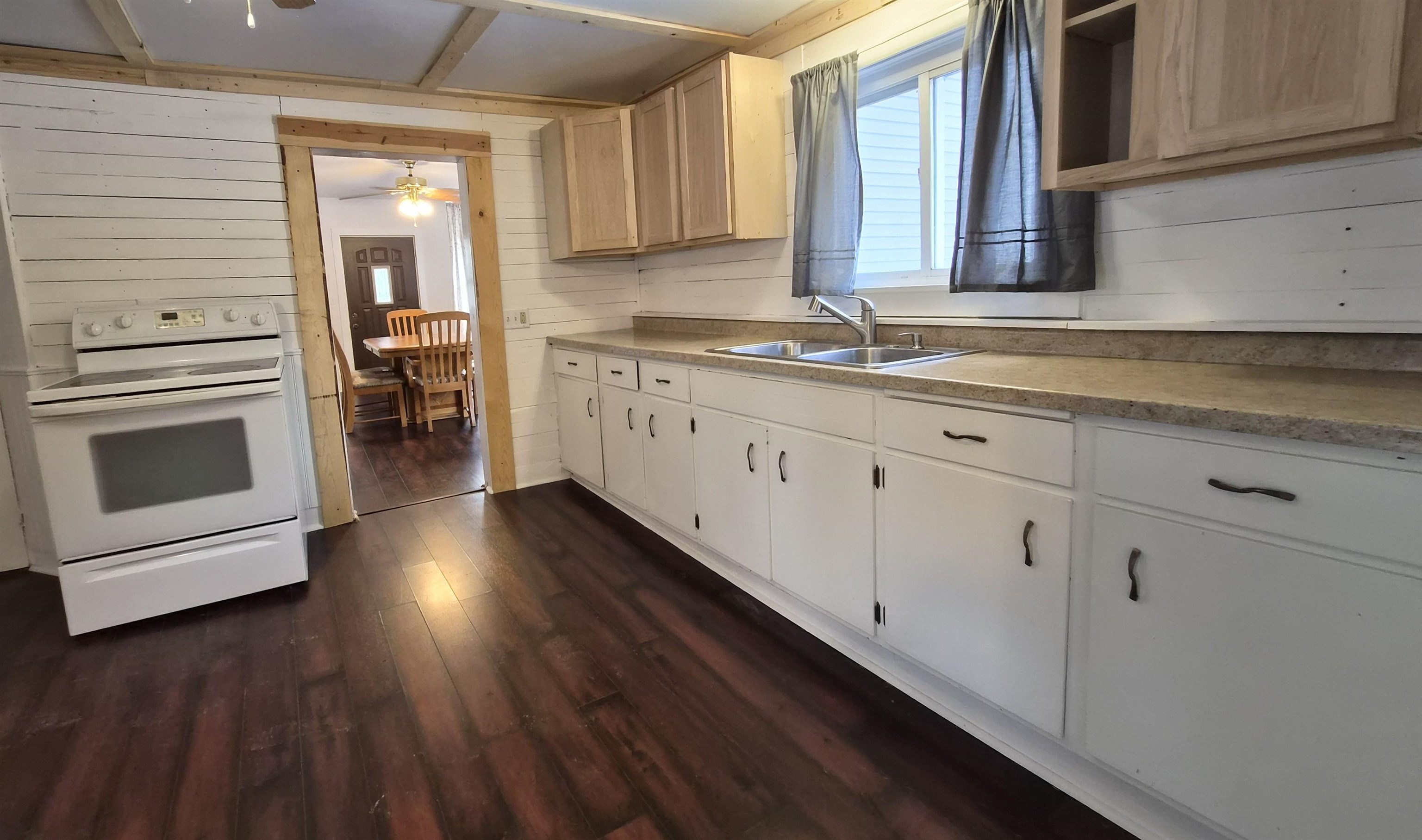 301 West Main Street Durand, IL 61024 - Photo 5 of 32 a kitchen with sink cabinets and wooden floor