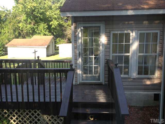 436 Lansing Street Raleigh, NC 27610 - Photo 4 of 6 a view of a deck with two chair and wooden floor