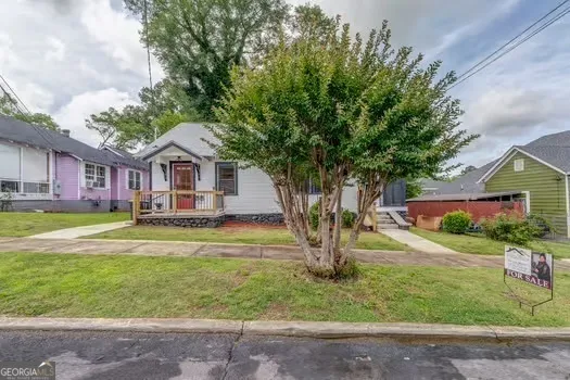 a front view of a house with garden