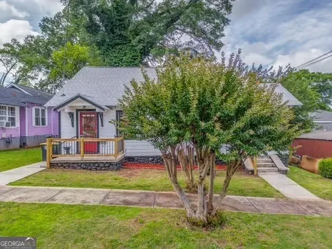 an aerial view of house with yard