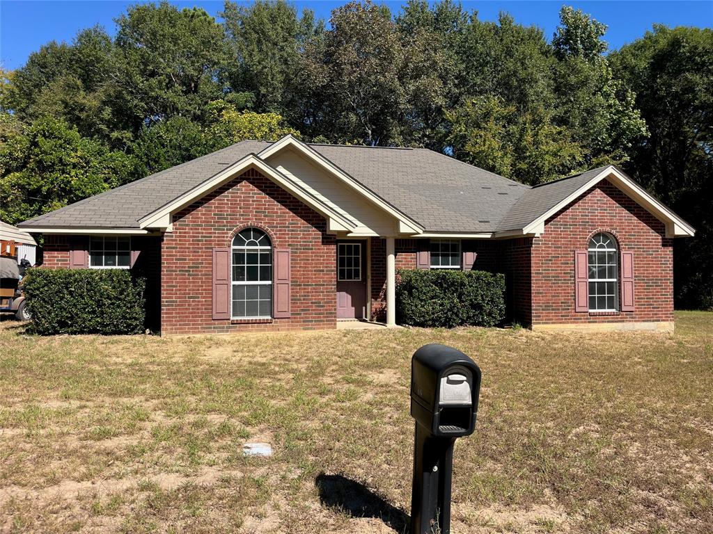 a front view of a house with parking yard