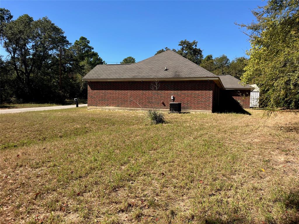 105 East Foggle Street Athens, TX 75751 - Photo 6 of 21 a view of a house with a yard