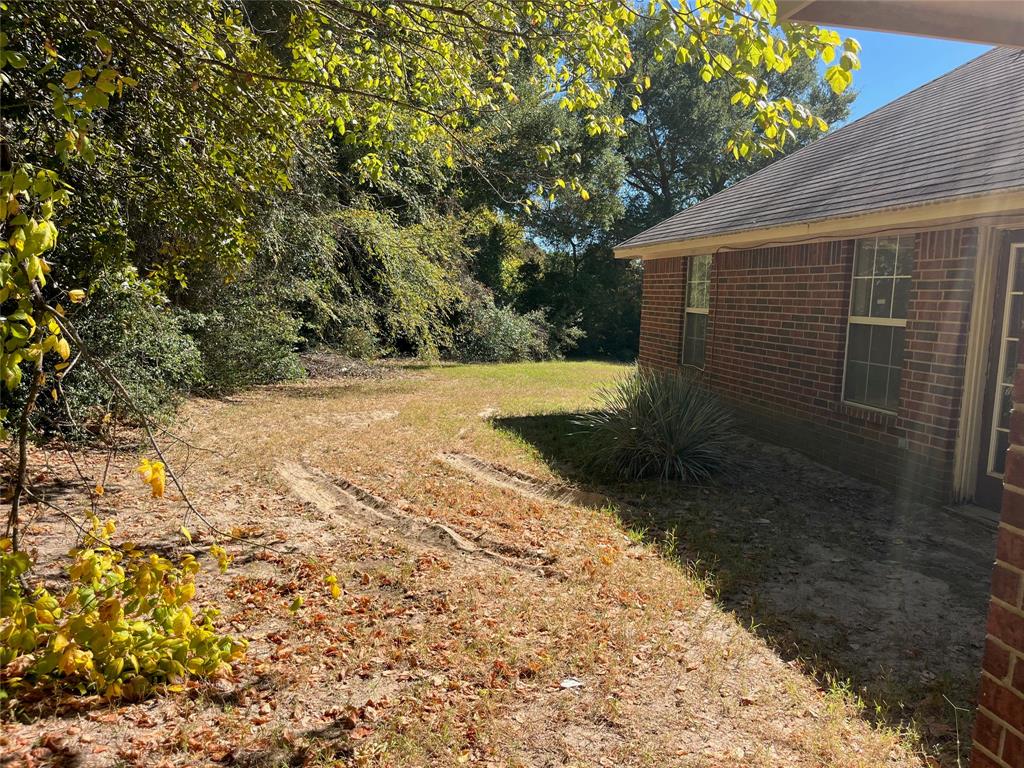 105 East Foggle Street Athens, TX 75751 - Photo 7 of 21 a view of backyard with green space