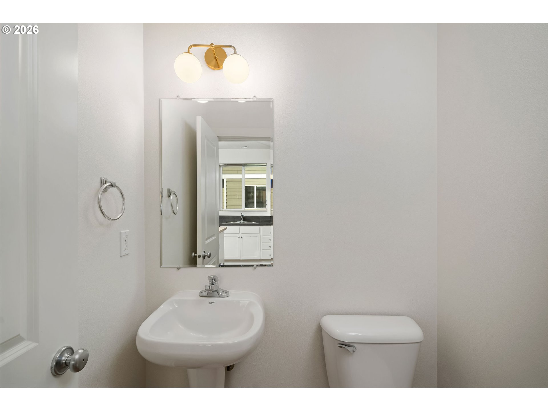 1190 Southwest 162nd Avenue Beaverton, OR 97006 - Photo 20 of 36 a bathroom with a sink mirror and vanity