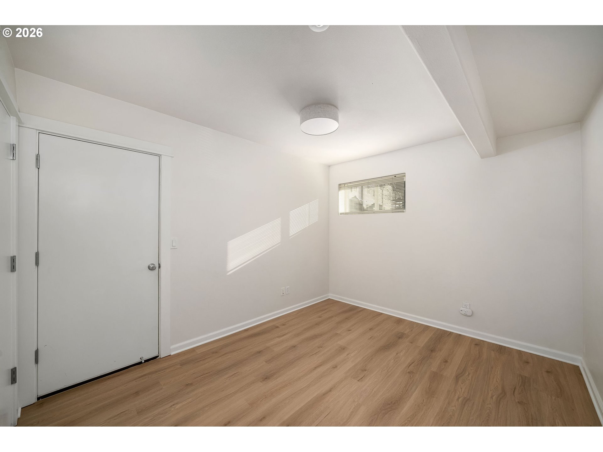 1190 Southwest 162nd Avenue Beaverton, OR 97006 - Photo 32 of 36 a view of an empty room with wooden floor