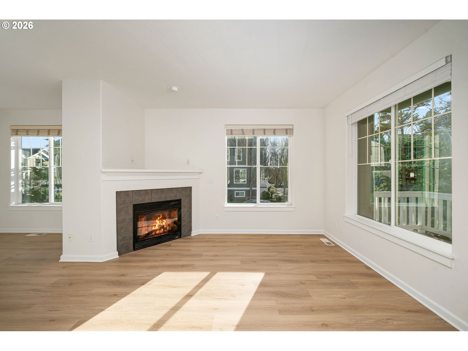 1190 Southwest 162nd Avenue Beaverton, OR 97006 - Photo 7 of 36 a view of an empty room with wooden floor and a window
