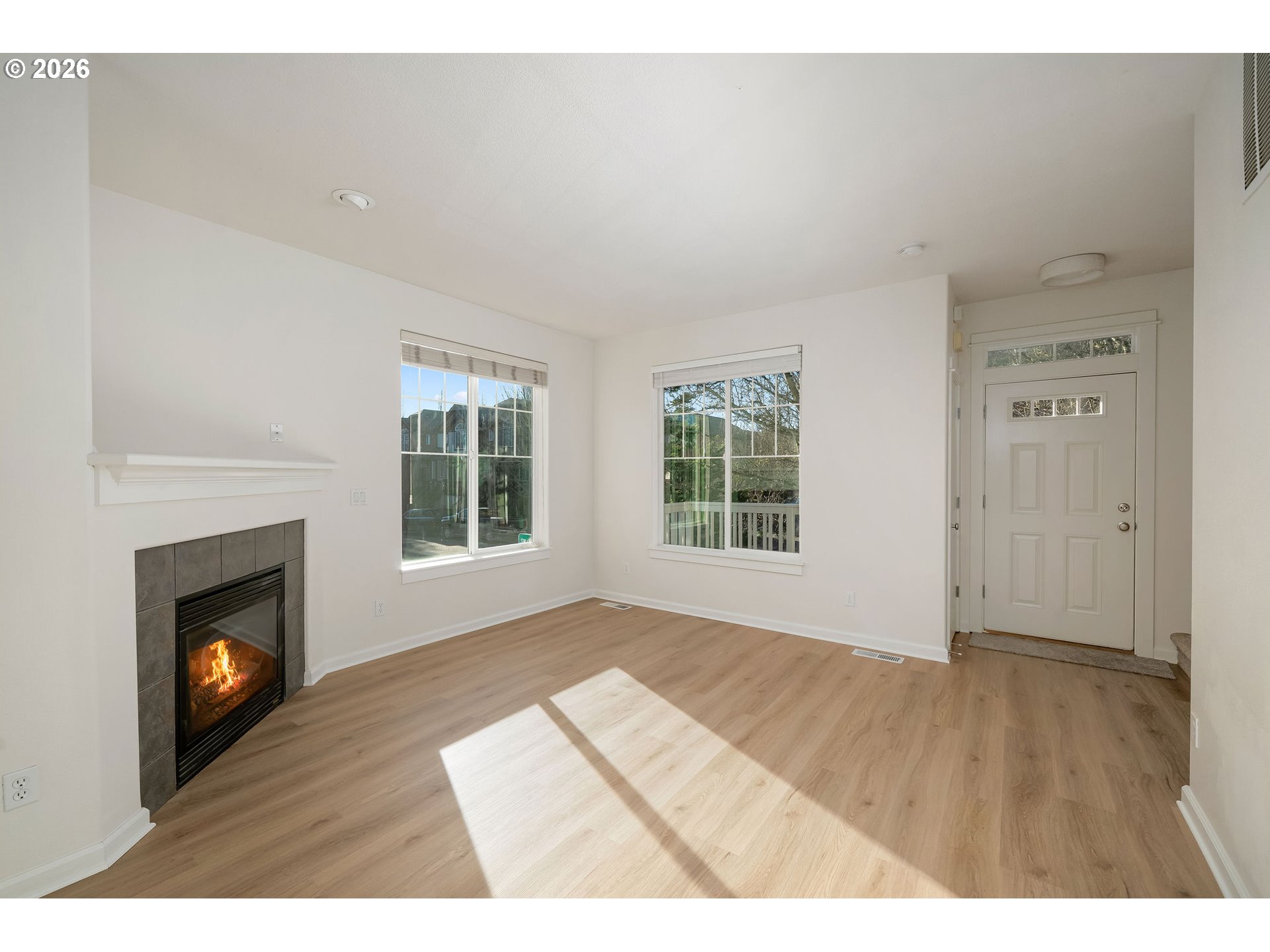 1190 Southwest 162nd Avenue Beaverton, OR 97006 - Photo 8 of 36 a view of empty room with wooden floor and fireplace