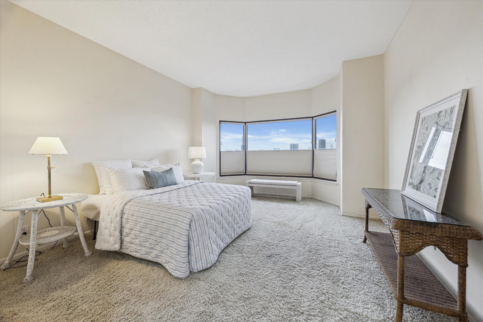 2001 Holcombe Boulevard, Unit 504 Houston, TX 77030 - Photo 12 of 38 a spacious bedroom with a bed and a lamp