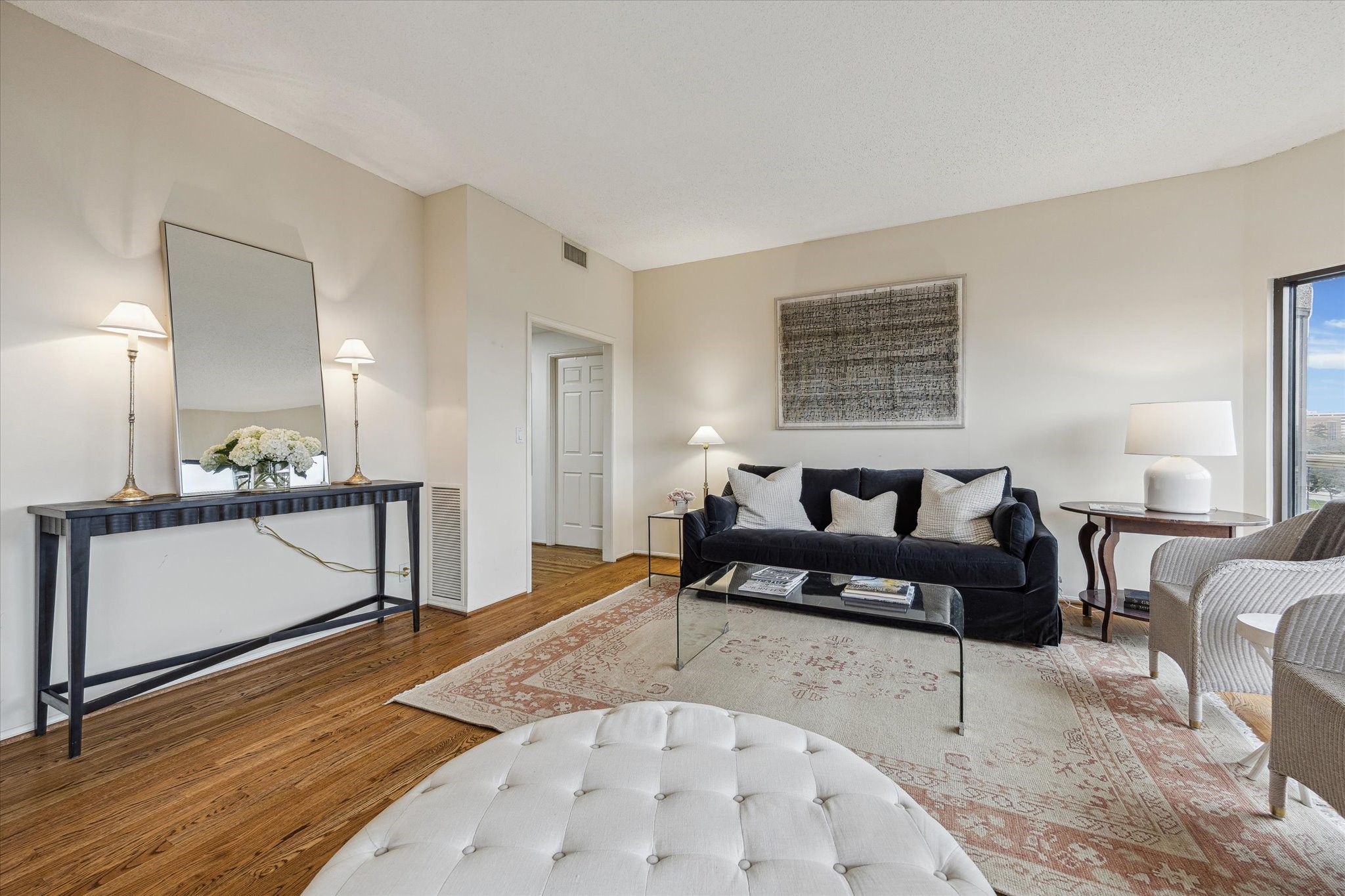 2001 Holcombe Boulevard, Unit 504 Houston, TX 77030 - Photo 4 of 38 a living room with furniture and a wooden floor