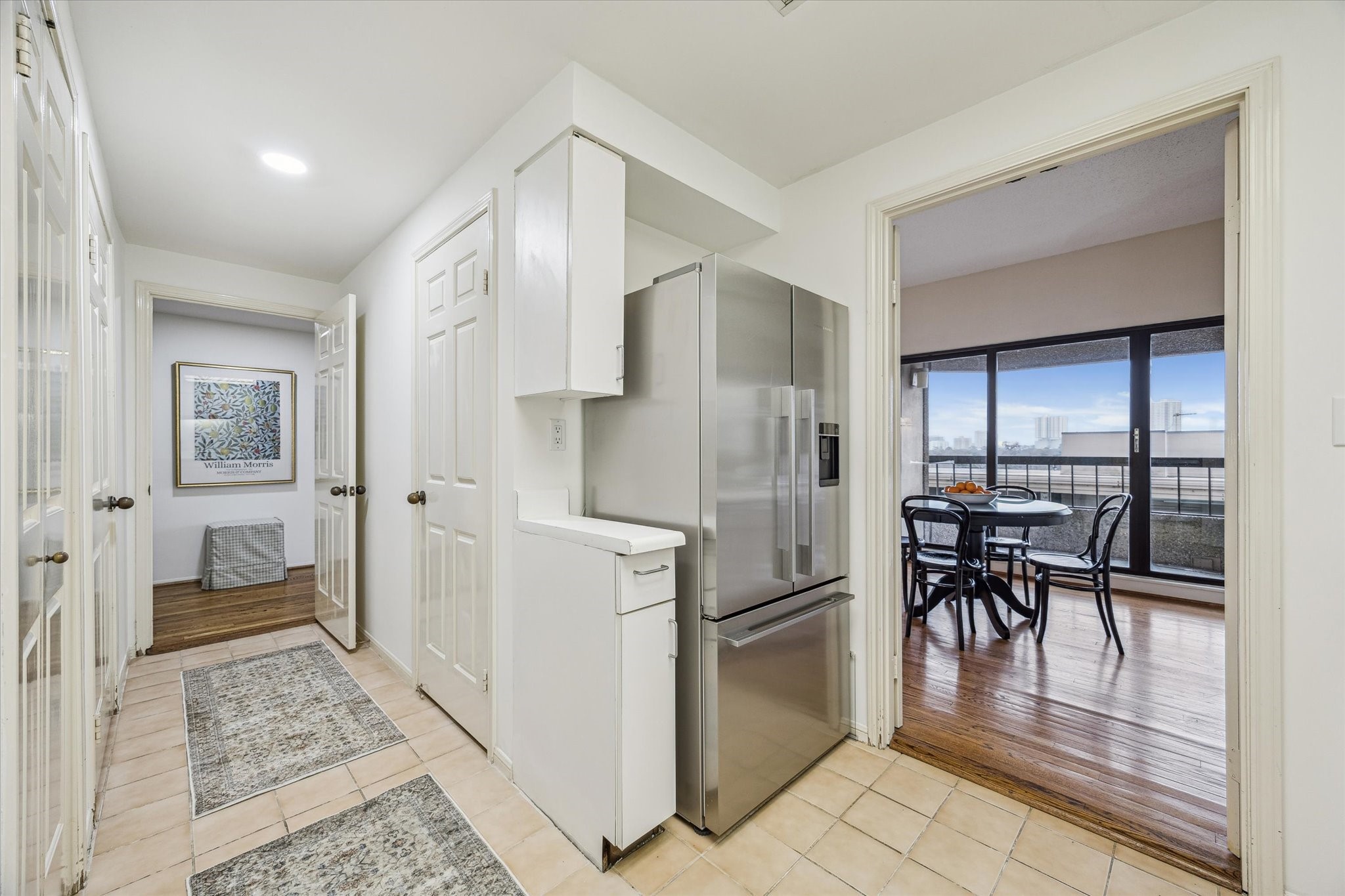 2001 Holcombe Boulevard, Unit 504 Houston, TX 77030 - Photo 9 of 38 a kitchen with stainless steel appliances kitchen island granite countertop a refrigerator and cabinets