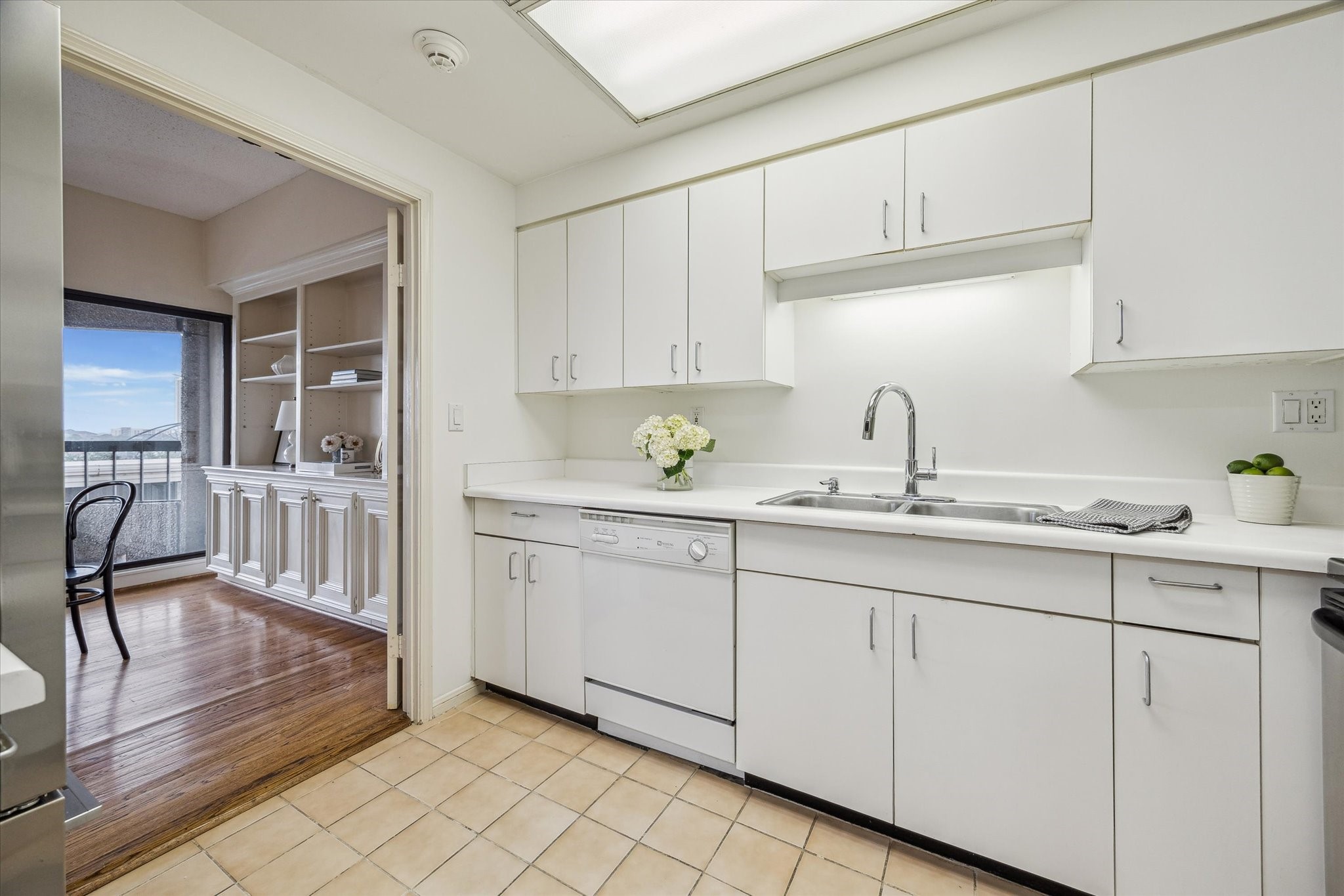 2001 Holcombe Boulevard, Unit 504 Houston, TX 77030 - Photo 10 of 38 a kitchen with sink cabinets and window