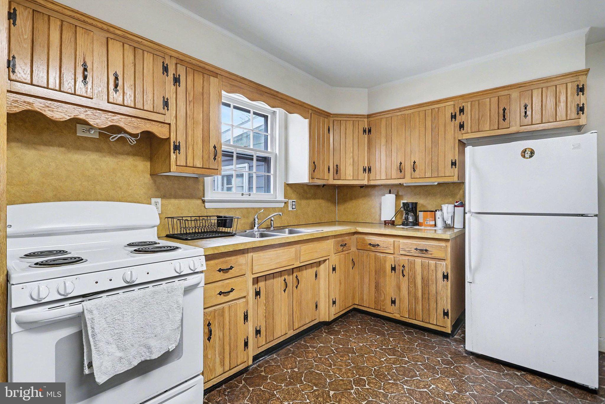 2072 Andover Drive Dover, PA 17315 - Photo 11 of 30 a kitchen with cabinets appliances a sink and a window