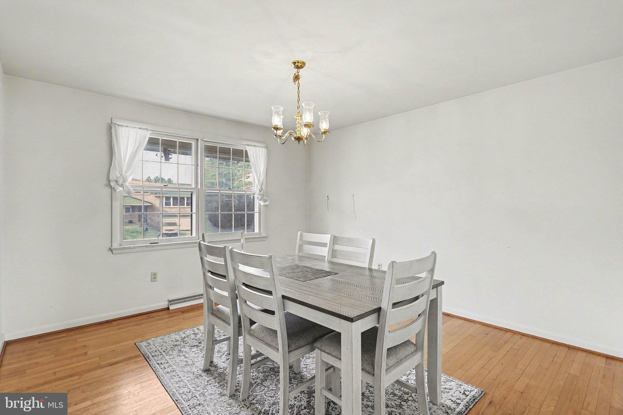 2072 Andover Drive Dover, PA 17315 - Photo 14 of 30 a view of a dining room with furniture and wooden floor