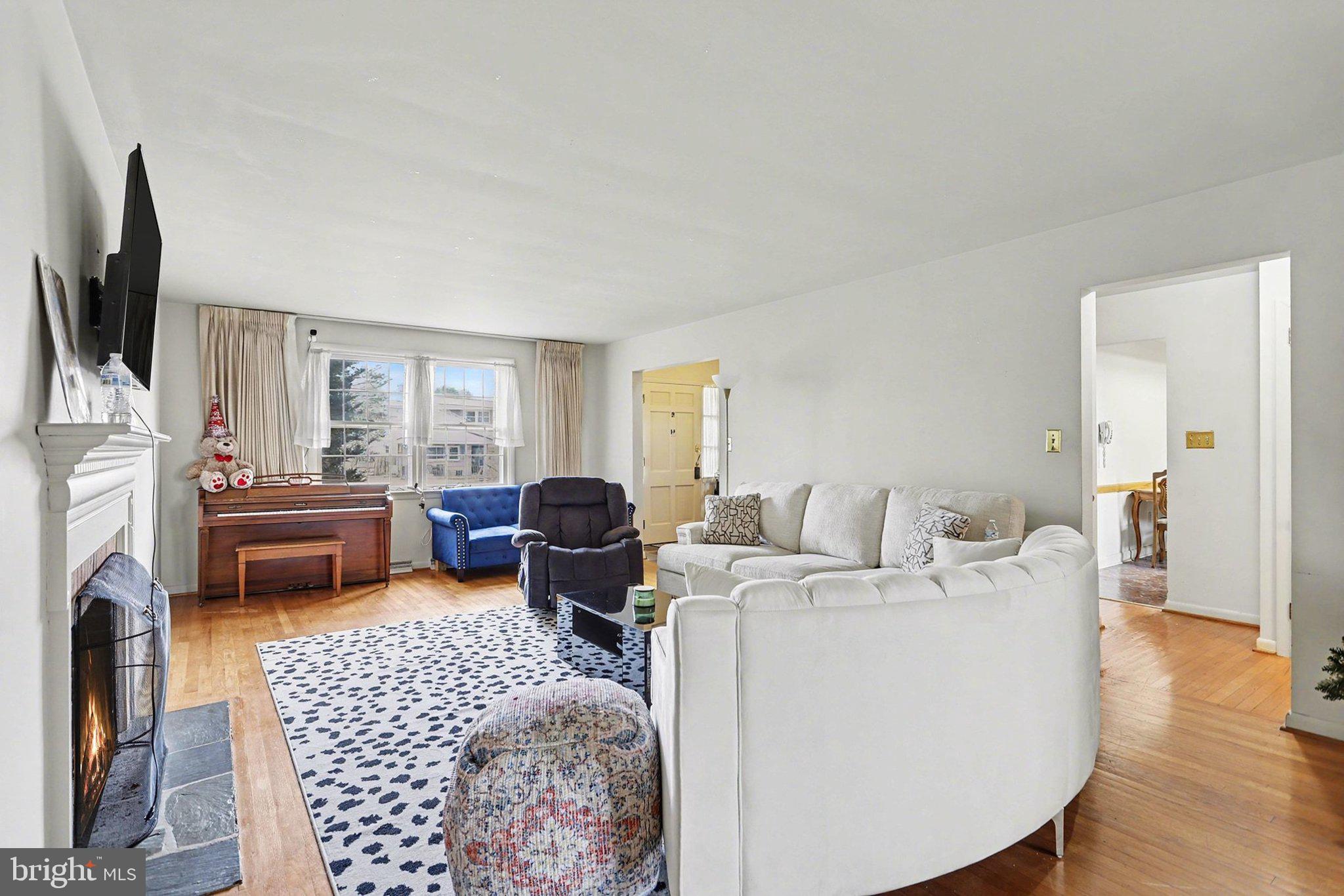 2072 Andover Drive Dover, PA 17315 - Photo 8 of 30 a living room with furniture a fireplace and a flat screen tv