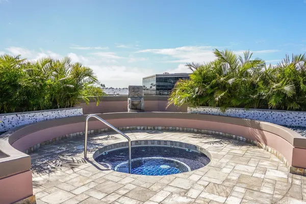 a view of a swimming pool with a yard