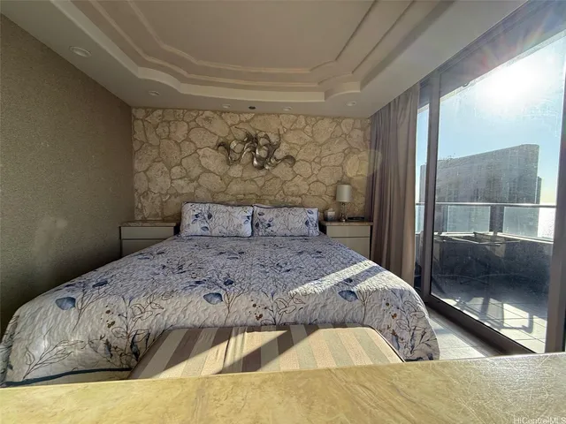 a bedroom with a bed and a couch