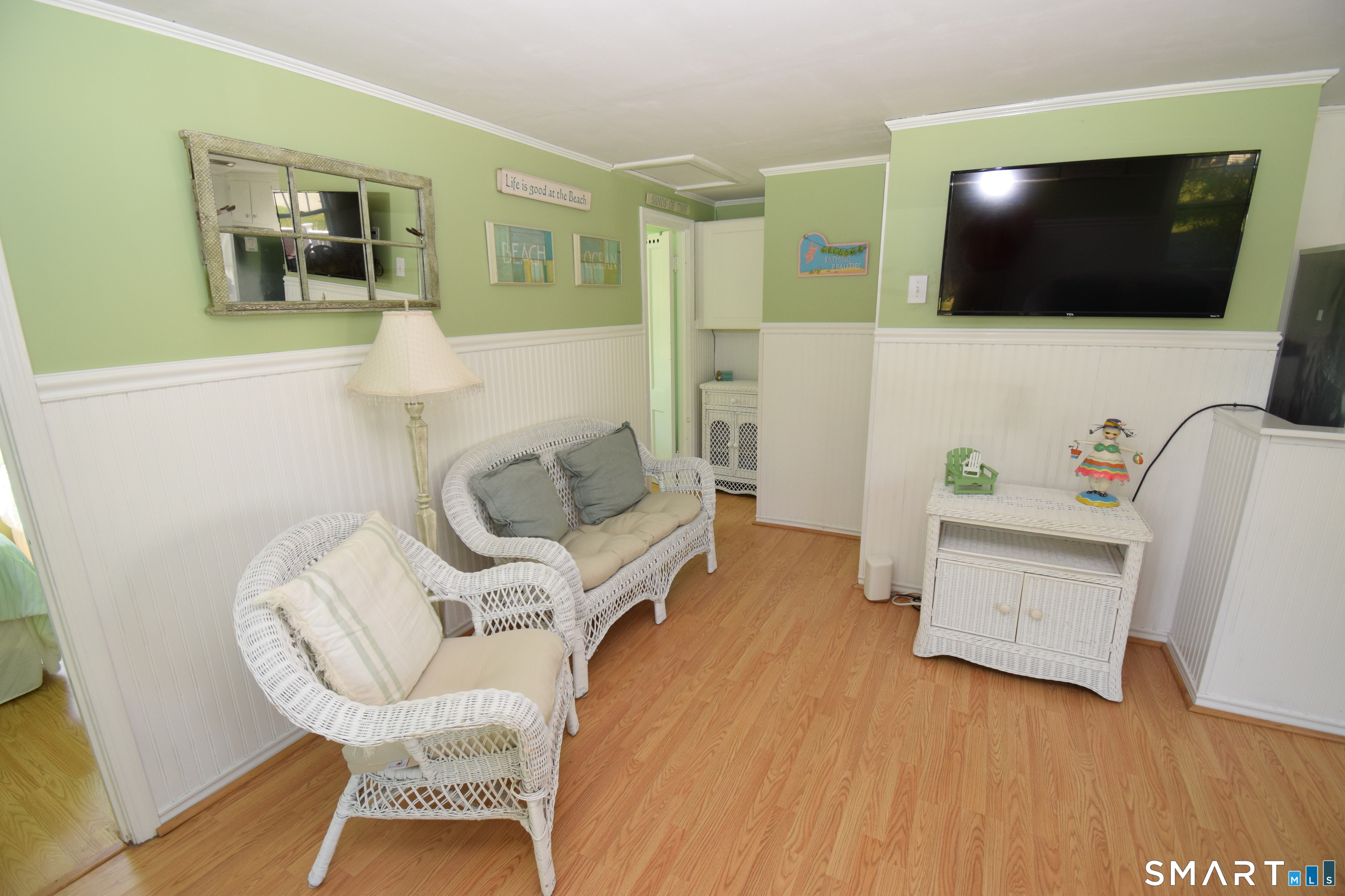 50 East Street Madison, CT 06443 - Photo 10 of 26 a living room with furniture and a flat screen tv
