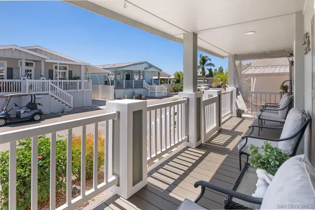 a view of a balcony with chairs