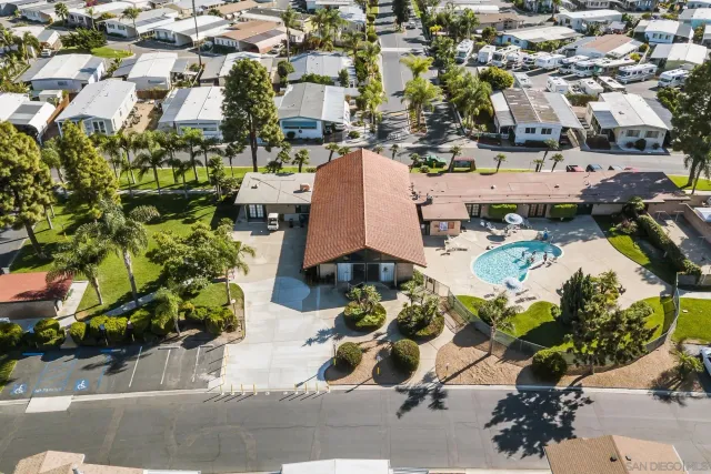 an aerial view of a houses with yard