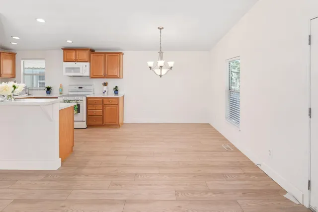 a view of a kitchen with microwave and cabinets