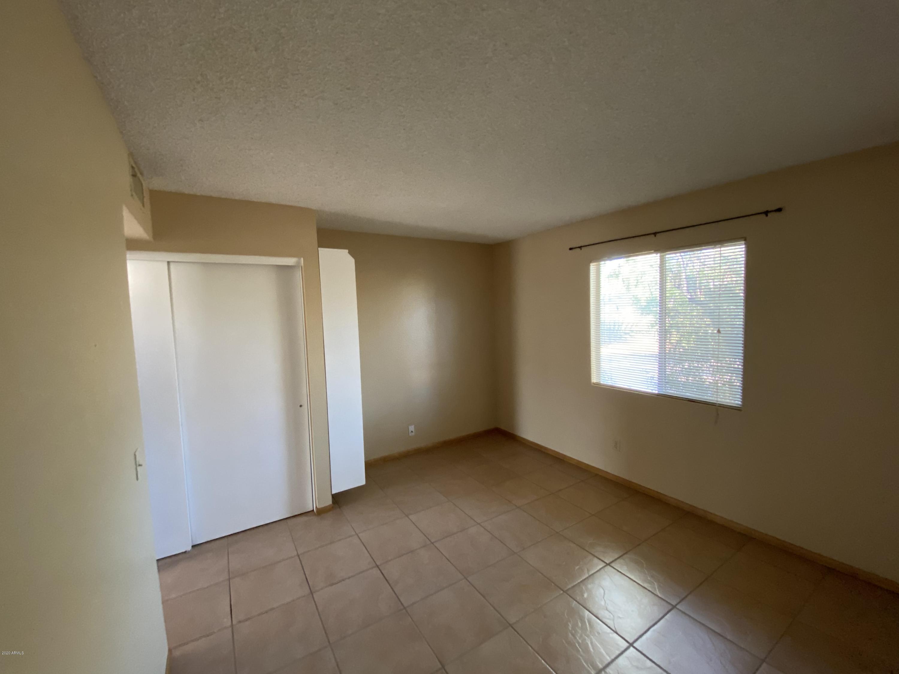 6932 West Paradise Drive Peoria, AZ 85345 - Photo 13 of 15 an empty room with windows