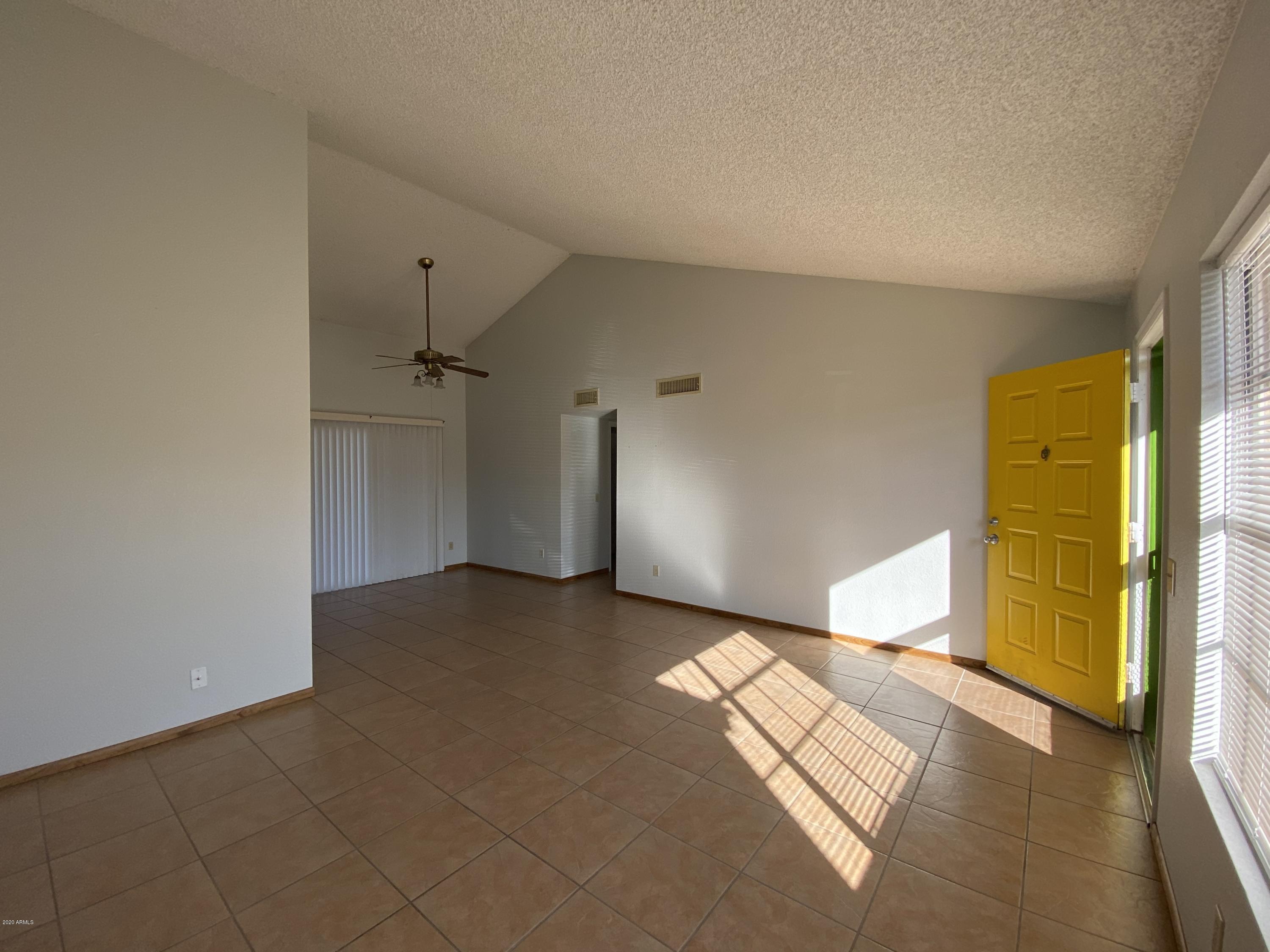 6932 West Paradise Drive Peoria, AZ 85345 - Photo 2 of 15 a view of a big room with a fireplace