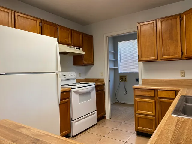 a kitchen with appliances and cabinets