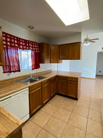 a kitchen that has a sink and a stove in it
