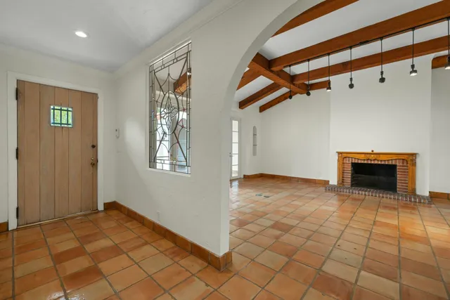 a view of an empty room with windows