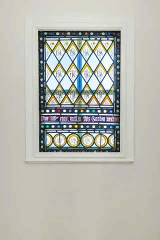 a view of kitchen with microwave and cabinets