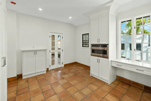 a bedroom with a bed closet and a window