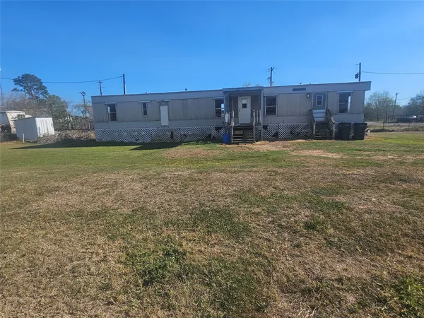 a view of wooden floor and chair in a room