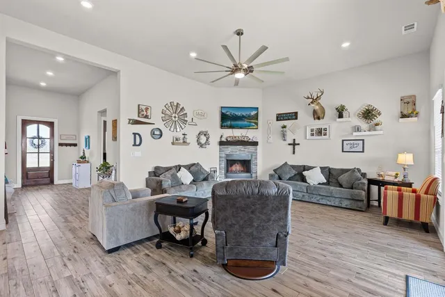a living room with furniture and a fireplace