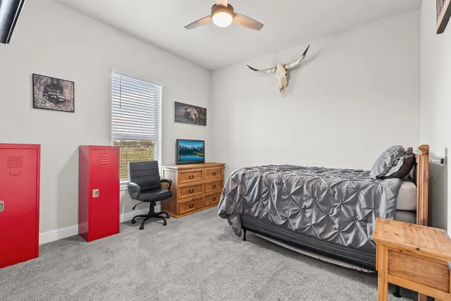 a bedroom with furniture and a bed