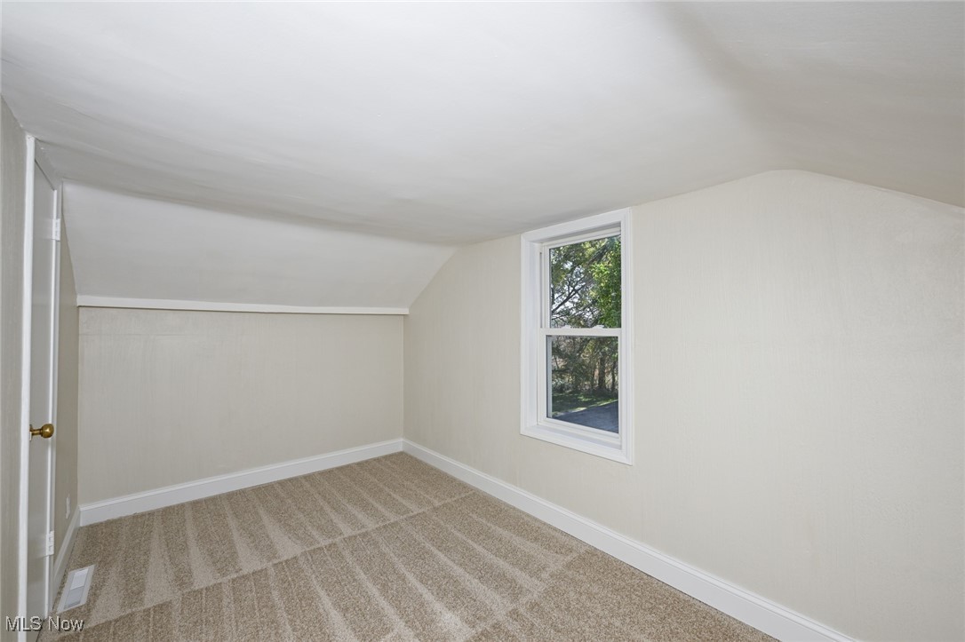 14328 Calaboone Road Doylestown, OH 44230 - Photo 24 of 45 Bedroom room featuring carpet floors and lofted ceiling