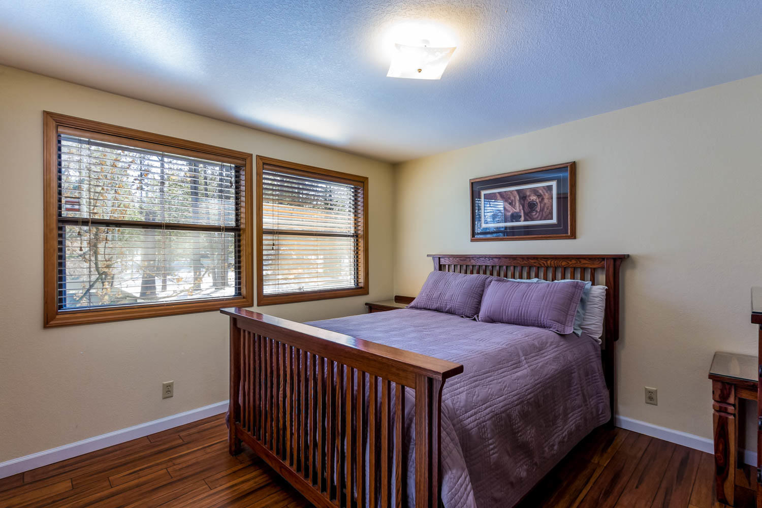 17704 Rogue Lane Sunriver, OR 97707 - Photo 24 of 26 a bedroom with a bed and a window