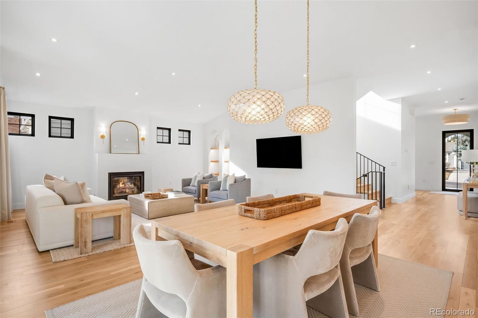 2900 South Madison Street Denver, CO 80210 - Photo 17 of 46 a living room with fireplace furniture and a flat screen tv