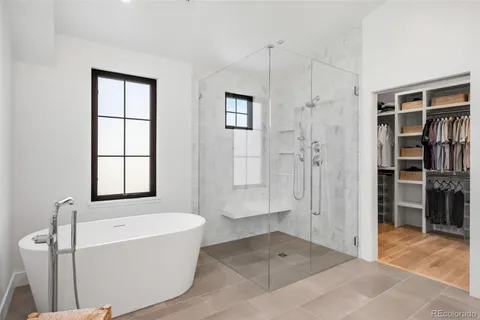 a bathroom with a bathtub and a shower