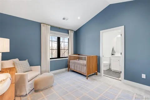 a bedroom with furniture and window