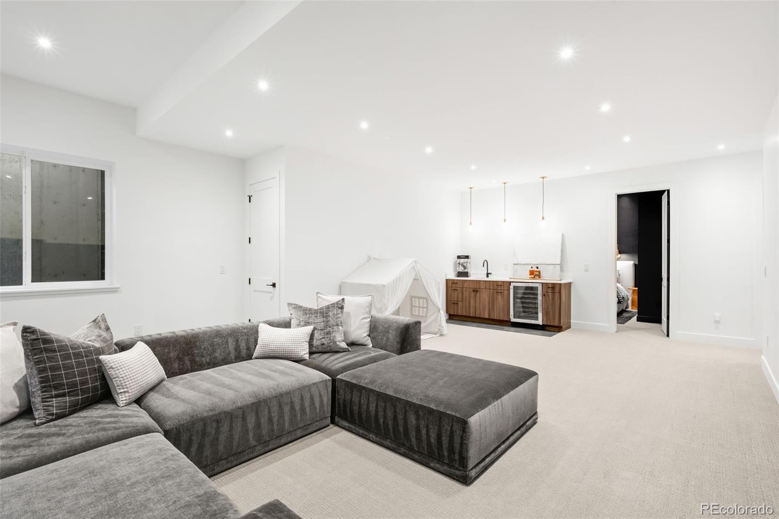 2900 South Madison Street Denver, CO 80210 - Photo 35 of 46 a living room with furniture and kitchen view