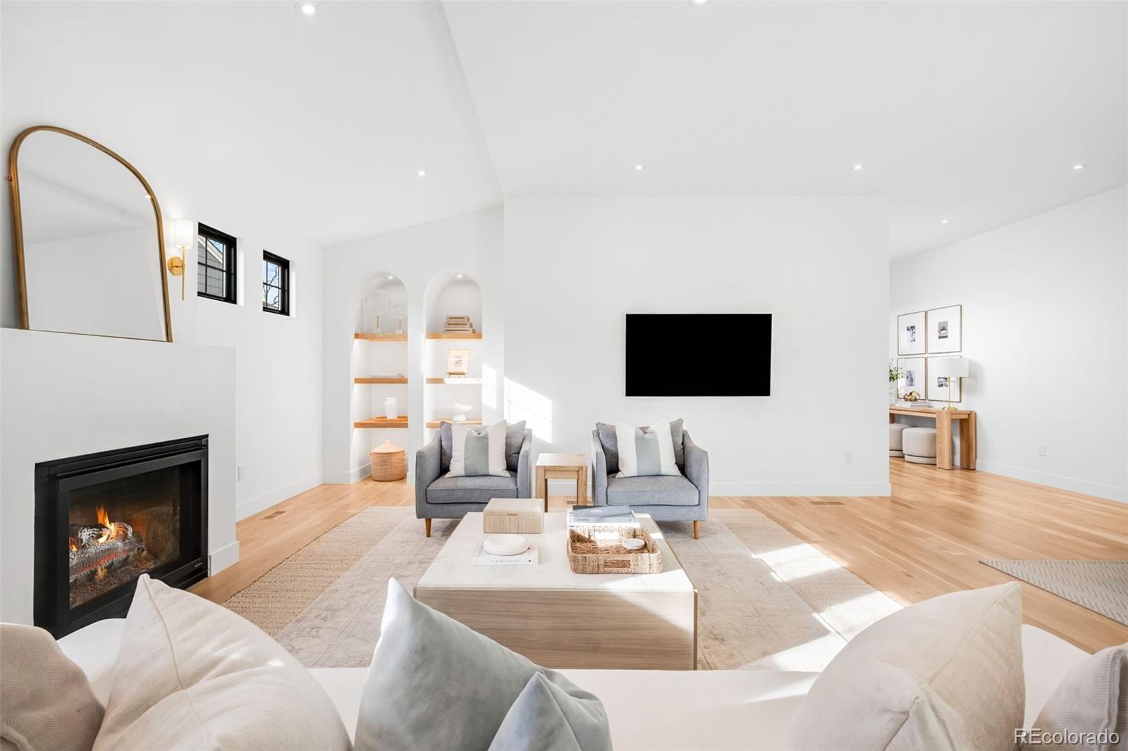 2900 South Madison Street Denver, CO 80210 - Photo 4 of 46 a living room with furniture and a flat screen tv