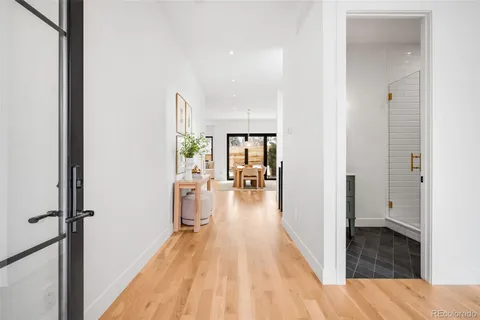a view of a living room and hardwood floor
