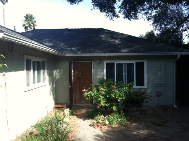 a house view with a garden space