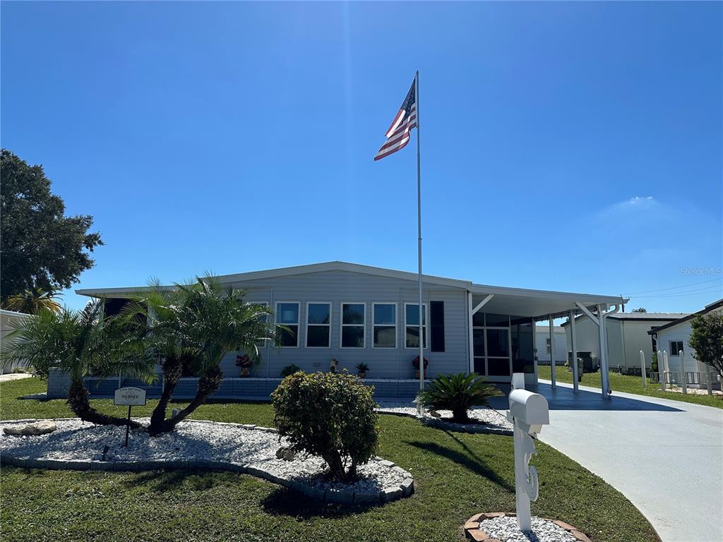 234 Cutter Court North Port, FL 34287 - Photo 1 of 1 a front view of a house with a garden and swimming pool