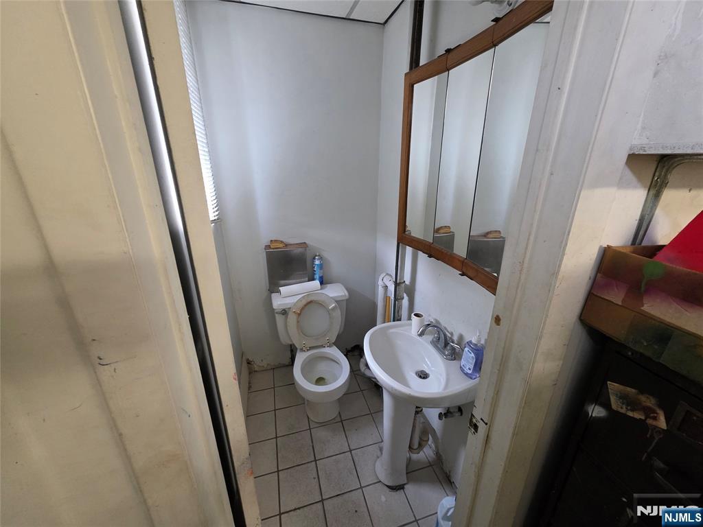 1449 Teaneck Road Teaneck, NJ 07666 - Photo 15 of 26 a bathroom with a sink and a mirror